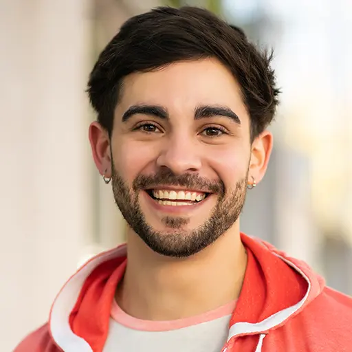 close up of young man smiling outdoors DELEX88.jpg