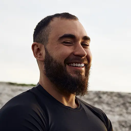 young bearded man portrait outdoors in the mountai 6Z46ZMB.jpg